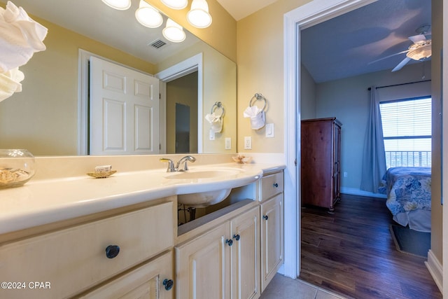 bathroom featuring hardwood / wood-style floors, sink, and ceiling fan