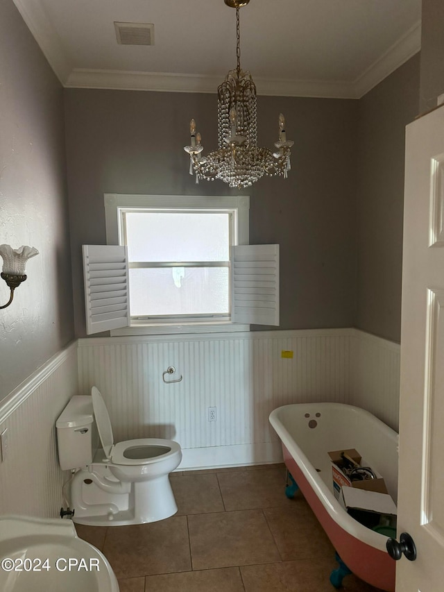 bathroom featuring crown molding, a bath, tile patterned flooring, a chandelier, and toilet