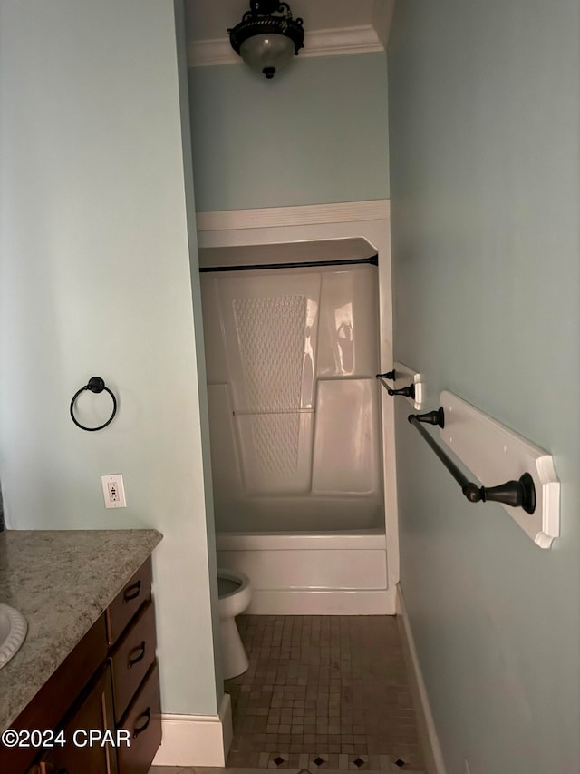 full bathroom with tile patterned flooring, crown molding, toilet, shower / washtub combination, and vanity