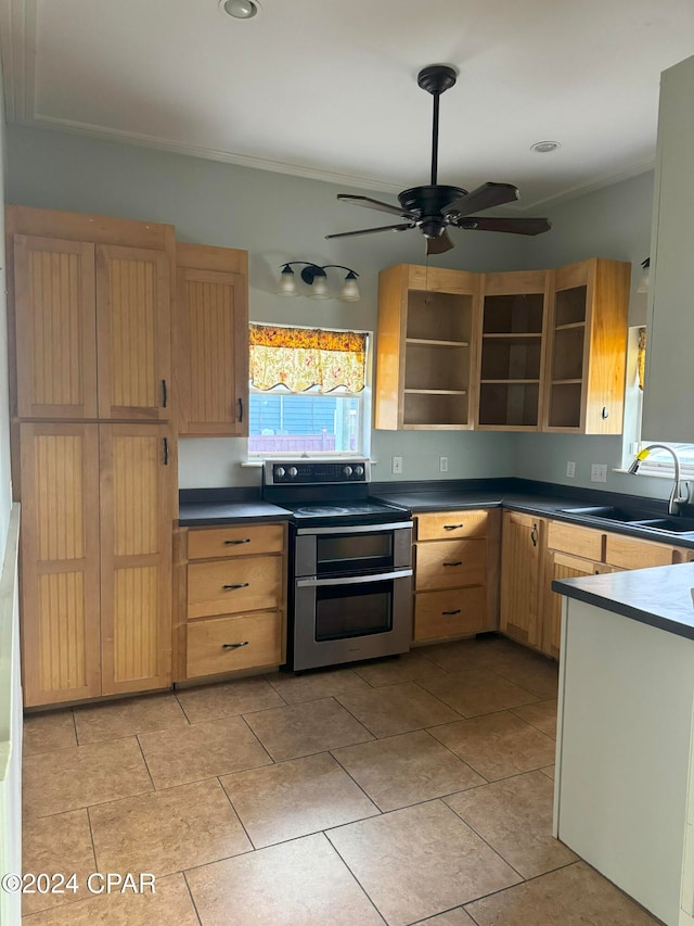 kitchen featuring electric range, ceiling fan, light brown cabinets, and sink