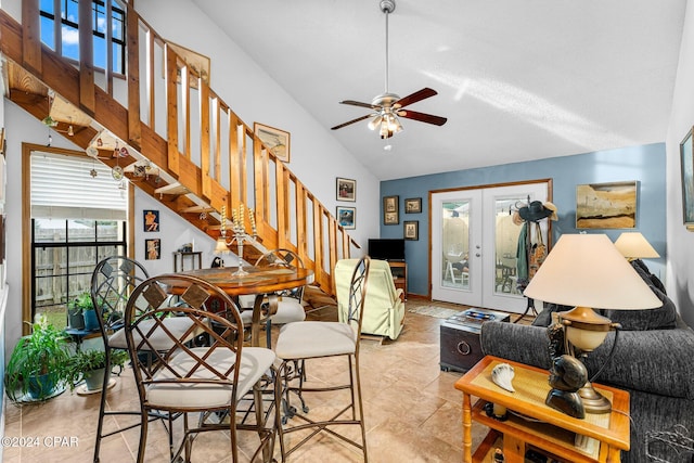 living room with ceiling fan, french doors, and high vaulted ceiling