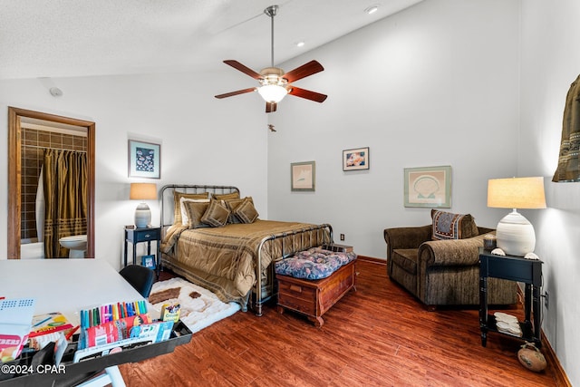 bedroom with a walk in closet, dark hardwood / wood-style flooring, high vaulted ceiling, and ceiling fan