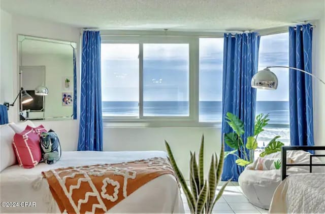 bedroom featuring a textured ceiling and multiple windows