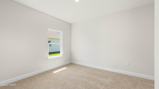 spare room featuring carpet floors