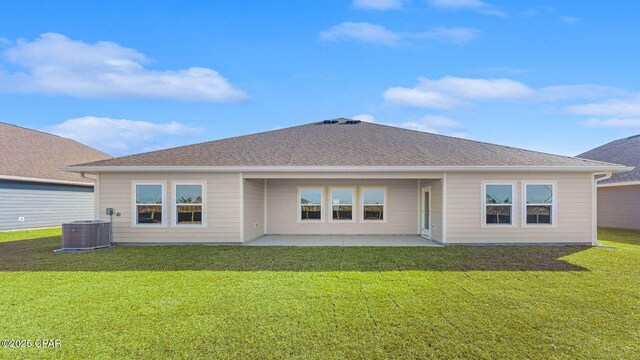 back of property featuring a yard, a patio area, and central air condition unit