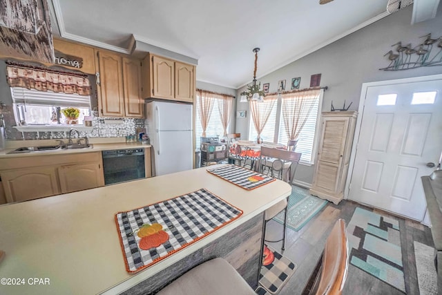 kitchen with dishwasher, hanging light fixtures, white fridge, lofted ceiling, and light wood-type flooring