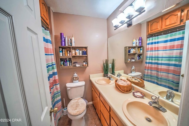 bathroom with tile patterned floors, vanity, toilet, and a shower with curtain