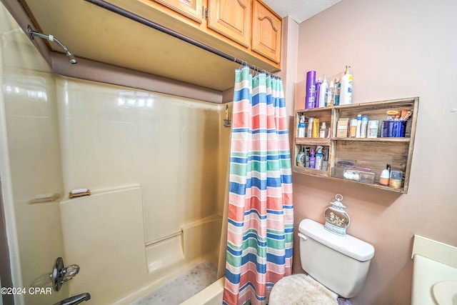 bathroom with shower / bath combination with curtain, toilet, and a textured ceiling