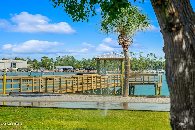 view of dock featuring a gazebo and a water view