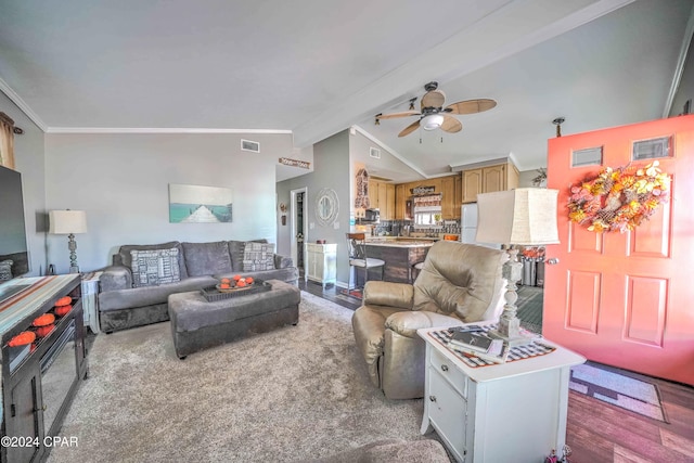 living room with hardwood / wood-style floors, vaulted ceiling with beams, ceiling fan, and ornamental molding