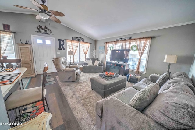 living room with ceiling fan, crown molding, lofted ceiling, and hardwood / wood-style flooring