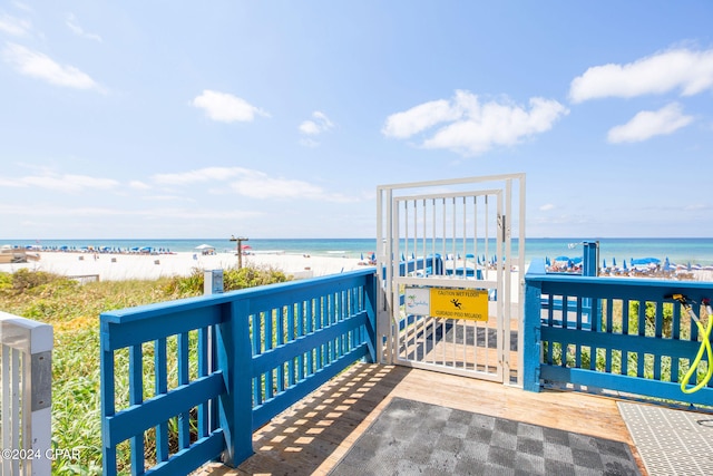 view of property's community featuring a view of the beach and a water view