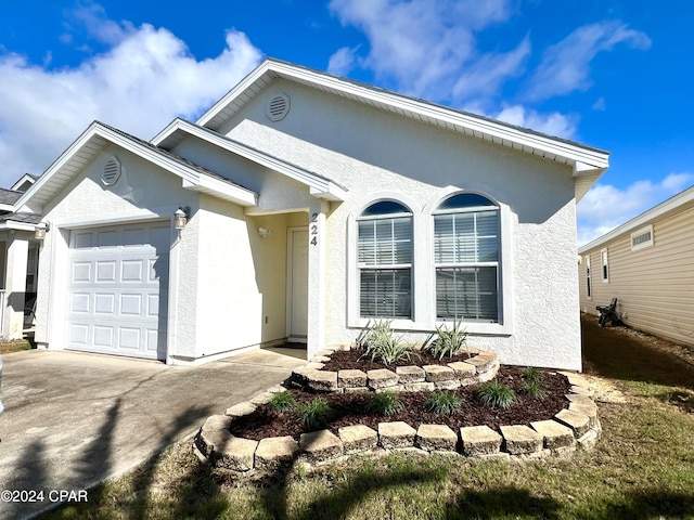 view of front of property with a garage