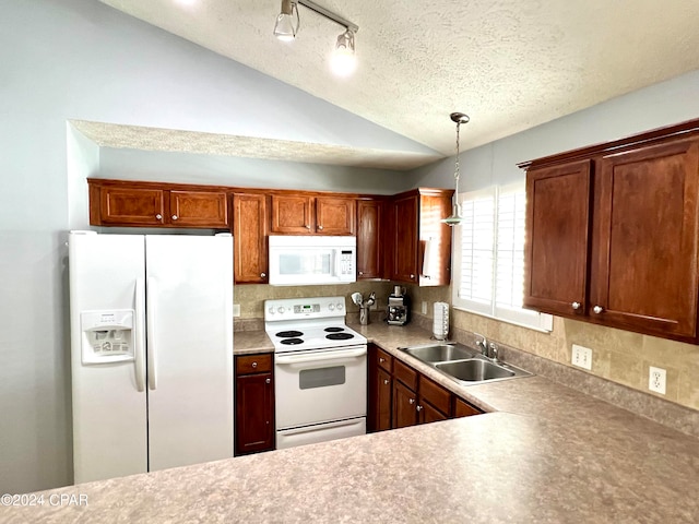 kitchen featuring sink, hanging light fixtures, tasteful backsplash, vaulted ceiling, and white appliances