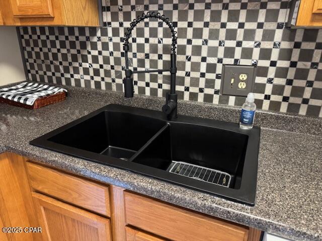 1301 Beck Ave Unit 16, Panama City, FL 32401 - details featuring a sink and decorative backsplash