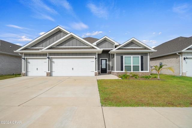 craftsman inspired home with a front yard and a garage