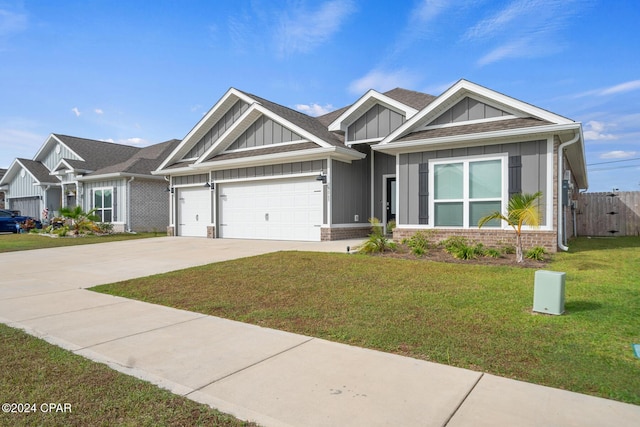 craftsman-style house with a front yard and a garage