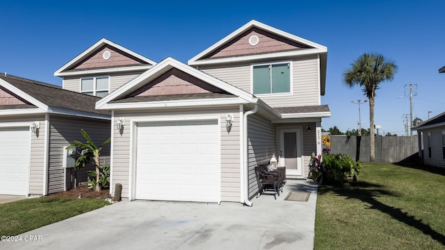 view of front of property with a garage and a front lawn