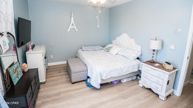 bedroom featuring ceiling fan and light hardwood / wood-style floors