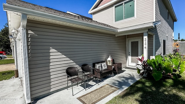 back of property with a patio