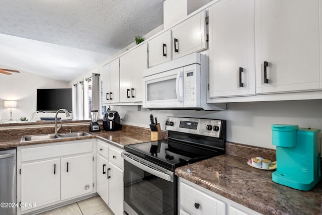 kitchen with white cabinetry, sink, ceiling fan, a textured ceiling, and appliances with stainless steel finishes