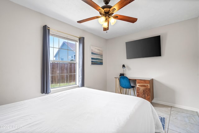 bedroom featuring ceiling fan and light tile patterned floors