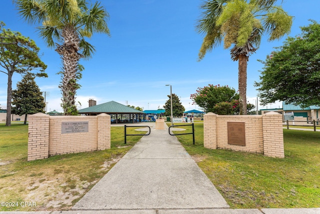 surrounding community with a lawn and a gazebo