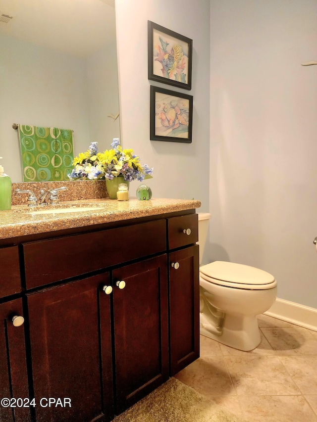 bathroom with toilet and vanity