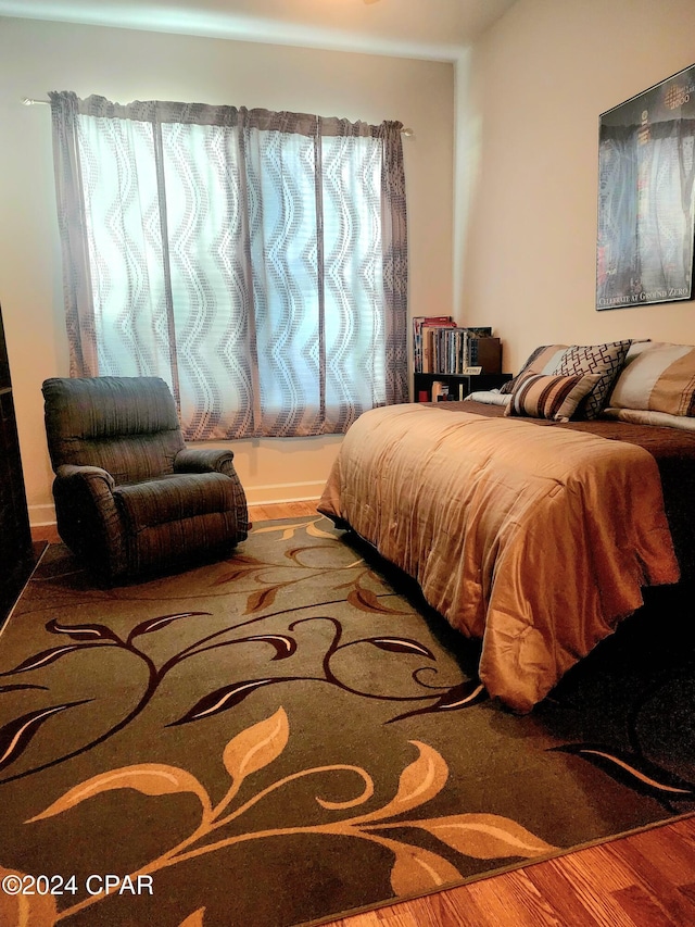 bedroom featuring hardwood / wood-style floors