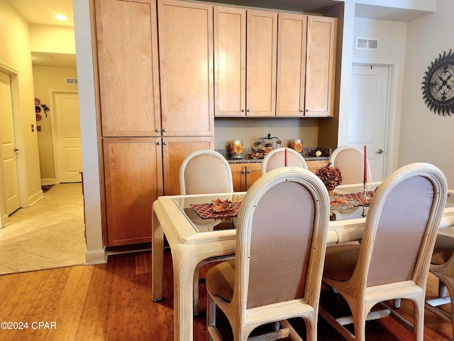 dining area featuring light wood-type flooring