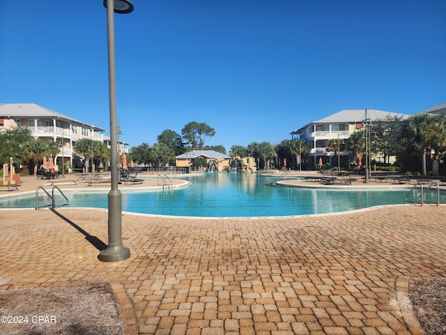 view of swimming pool featuring a patio area