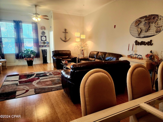 living room featuring ceiling fan, crown molding, and hardwood / wood-style floors