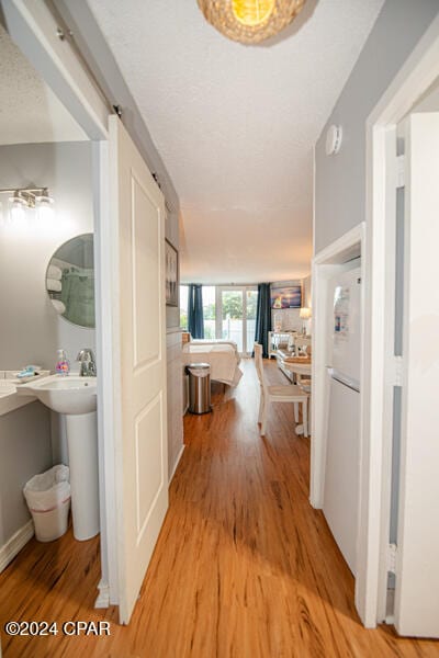 hallway with light wood-type flooring