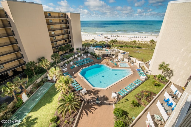 bird's eye view featuring a view of the beach and a water view