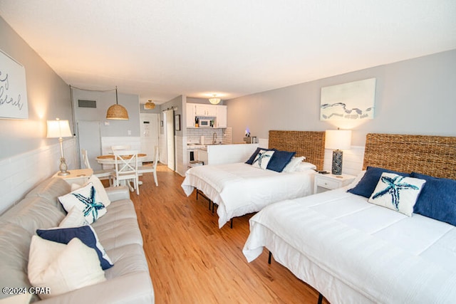 bedroom featuring light hardwood / wood-style flooring