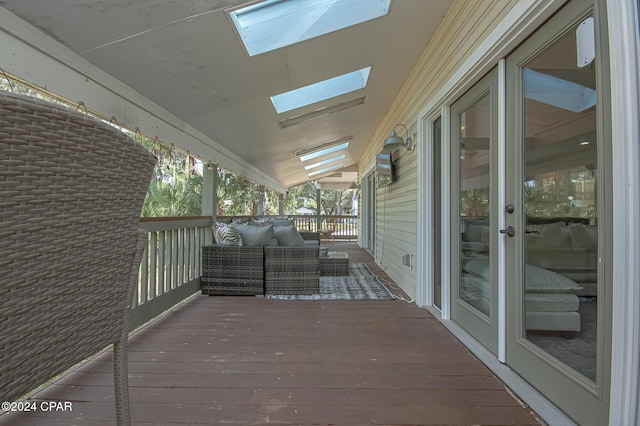 wooden deck with outdoor lounge area