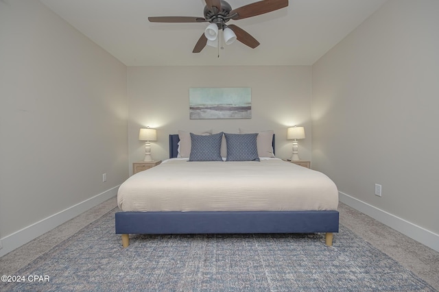 bedroom featuring carpet flooring, a ceiling fan, and baseboards