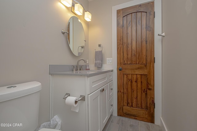 half bath with toilet and vanity