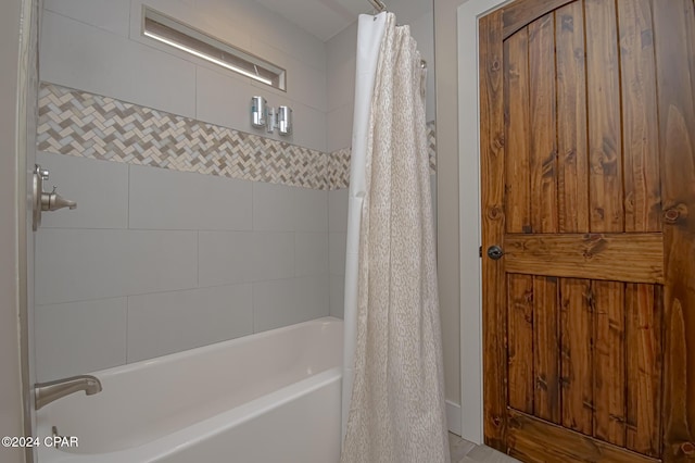 full bathroom featuring shower / bath combo with shower curtain