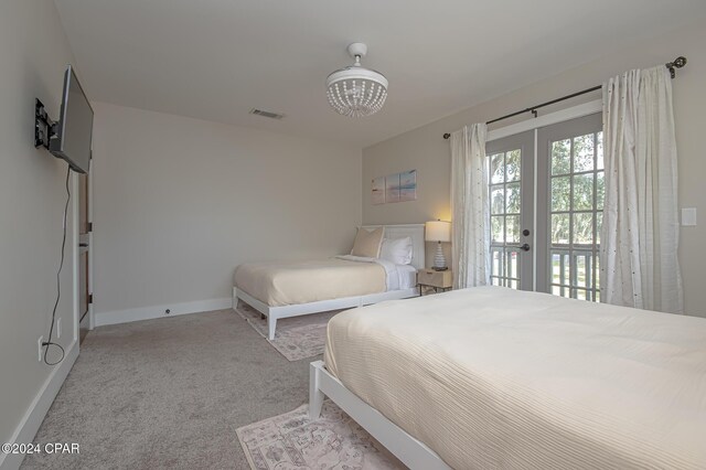 bedroom featuring access to exterior, french doors, visible vents, carpet flooring, and baseboards