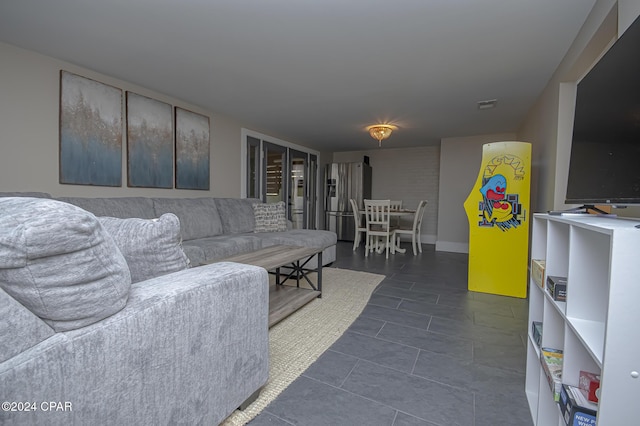 living room featuring visible vents and baseboards