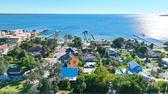 drone / aerial view featuring a residential view and a water view