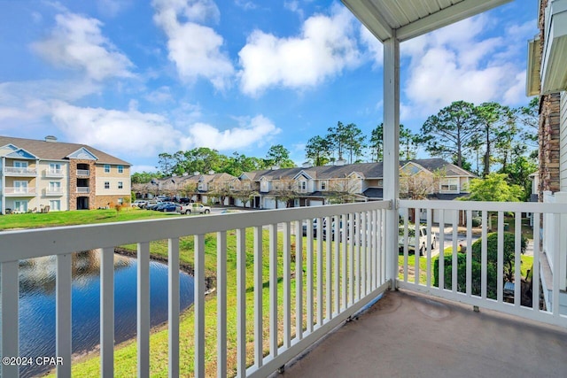 balcony featuring a water view