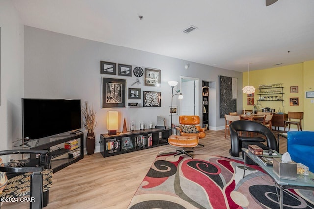 living room with light hardwood / wood-style flooring