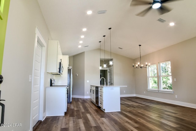 kitchen with dark hardwood / wood-style flooring, an island with sink, pendant lighting, lofted ceiling, and white cabinets