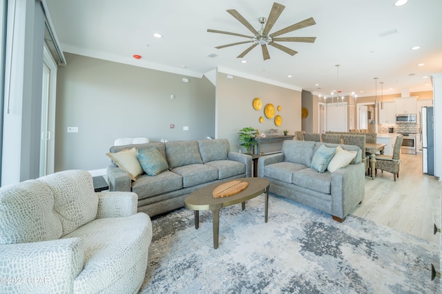 111 31st St Unit A & B, Mexico Beach, FL 32456 - living room featuring ornamental molding and light hardwood / wood-style floors