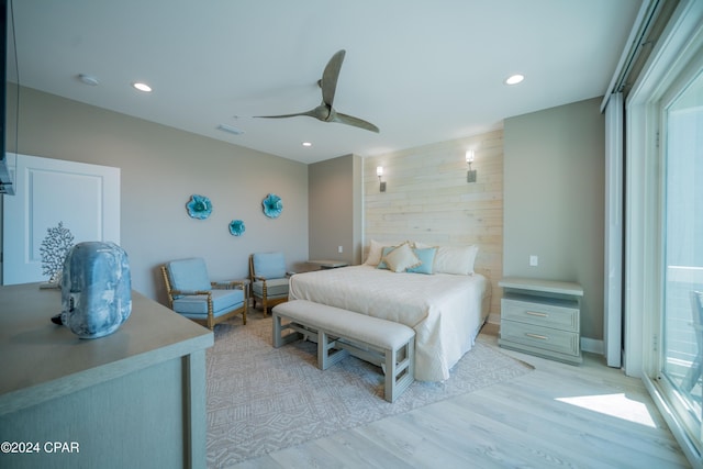 111 31st St Unit A & B, Mexico Beach, FL 32456 - bedroom with ceiling fan, light hardwood / wood-style floors, and wood walls