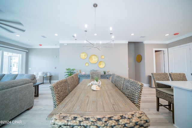 111 31st St Unit A & B, Mexico Beach, FL 32456 - dining space with ornamental molding, a notable chandelier, and light hardwood / wood-style flooring