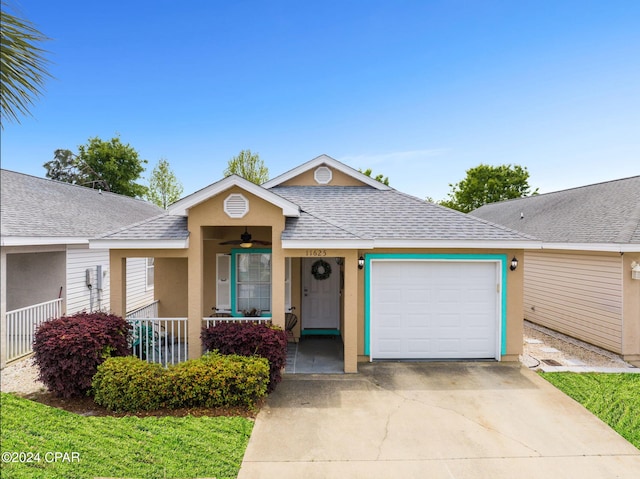 ranch-style home with a porch and a garage