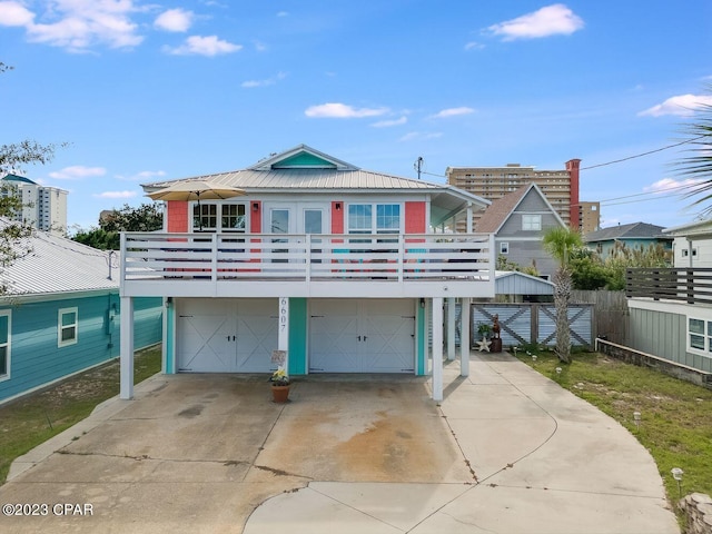 view of front of house featuring a balcony and a garage